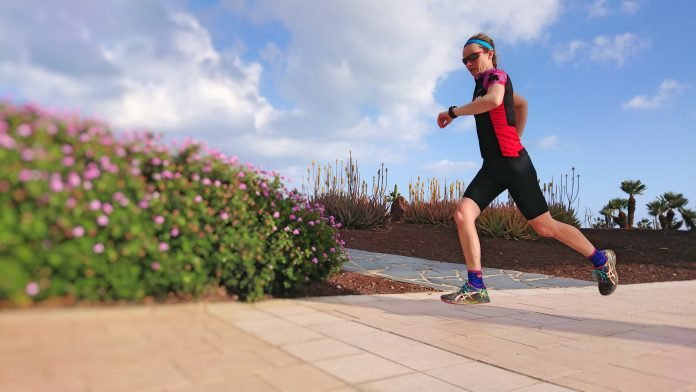 Athlete Running With Watch