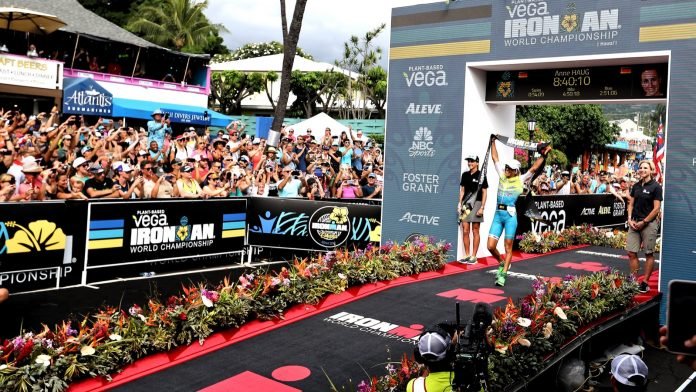 Anne Haug crosses the finish line of the 2019 Ironman World Championships