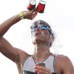 How Does Dehydration Affect Triathlon Performance? Pouring Water Over Head In Ironman